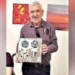 Dean McMahon with his artworks and crafts.