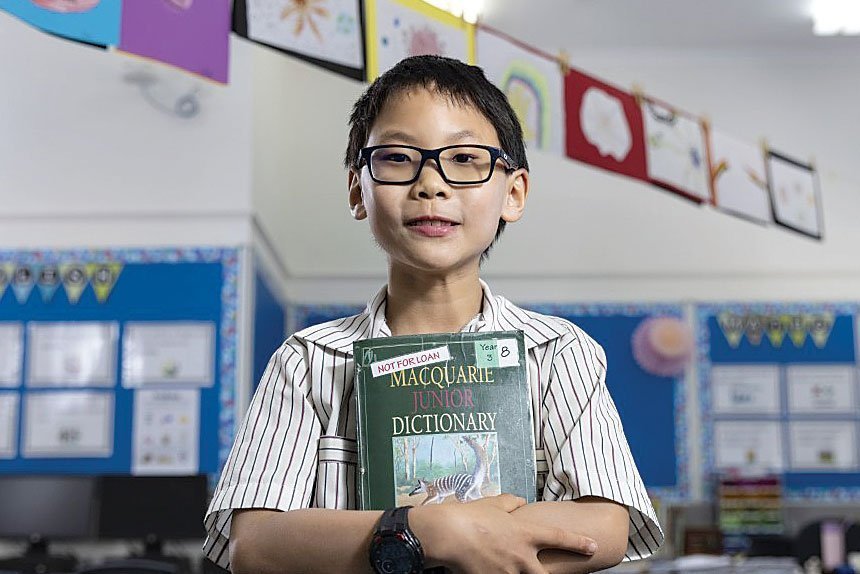 NEW WORDS: William is always searching for new and interesting words and he finds them daily in the school library’s dictionary collection.