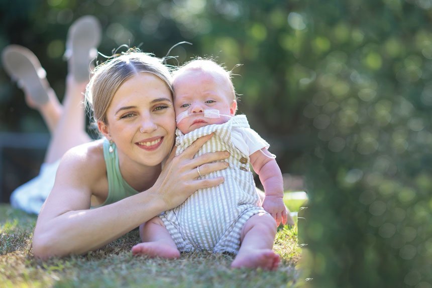 TRUE FIGHTER: Oliver has overcome all obstacles with the help of specialist medical teams and the loving care of mum Erika and her partner Lachlan.