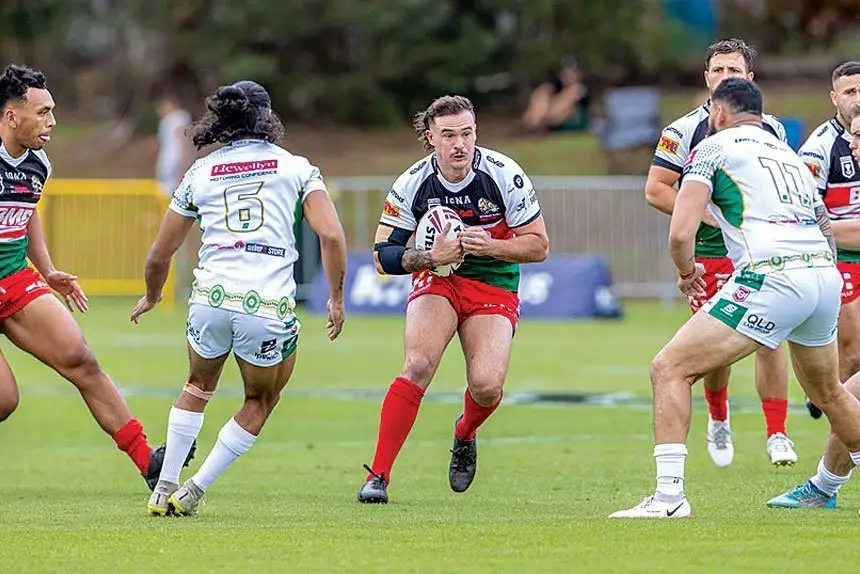 TOUGH MATCH: Wynnum Manly’s Kobe Hetherington brings the ball up against the Jet’s defence in the weekend game won 50-6 by Wynnum. PHOTO: JIM O’REILLY/QRL
