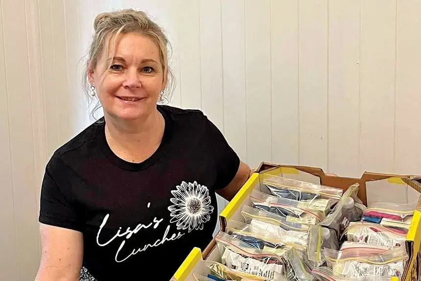 HERE TO HELP: Jacqui Martin prepares to deliver more food packs as part of the not-for-profit work of Lisa’s Lunches.