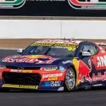 FIRING UP: The Red Bull 97 car screams around a corner in the final testing before the start of the season.