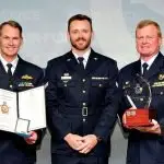 WELL DONE: Warrant Officer of the Air Force Ralph Clifton (right) along with The Chief of Air Force, Air Marshal Robert Chipman, AM, CSC (left) present the Enlisted Aviator of the Year Award to Corporal Jack Simpson.