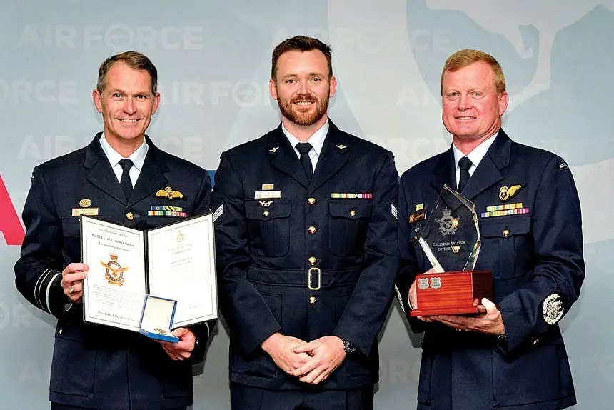 WELL DONE: Warrant Officer of the Air Force Ralph Clifton (right) along with The Chief of Air Force, Air Marshal Robert Chipman, AM, CSC (left) present the Enlisted Aviator of the Year Award to Corporal Jack Simpson.