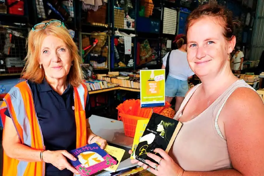 ANOTHER SALE: Lifeline business manager, Cheryl Shaw, with happy bookfest shopper, Ellie Jade from Mt Marrow.