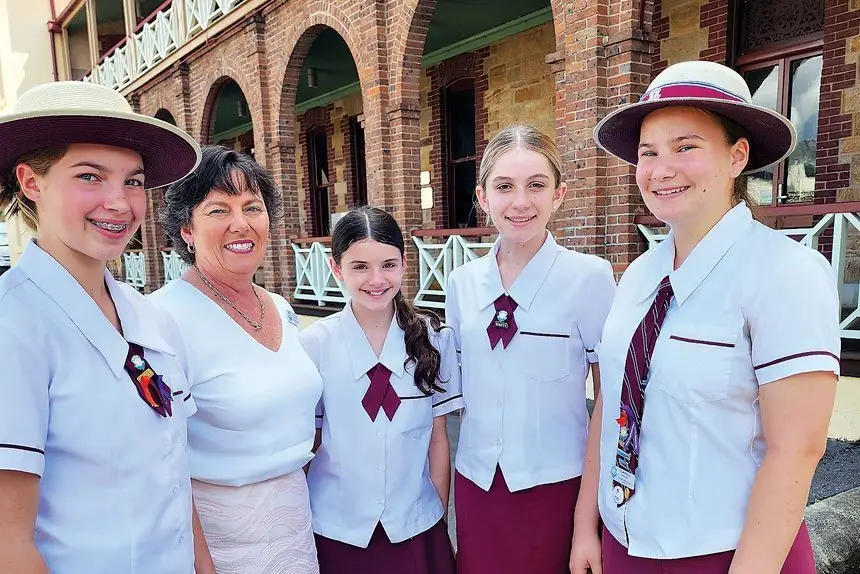 IN TOUCH: St Mary’s College Principal, Paula Goodwin catching up with students Ivy Newby, Sienna Goulding, Scarlett Kitching and Charli Precians.