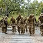 READY TO BLOW: Australian Army sappers from the 2nd Combat Engineer Regiment remove timber planks from Elanora Bridge to lay high explosive charge in preparation for demolition during Exercise Terrier Walk at Shoalwater Bay Training Area, Queensland.