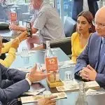 EAR OF THE PM: Maha Sinnathamby, Shayne Neumann and Bob Sharpless with PM Albanese at Orion Shopping Centre.