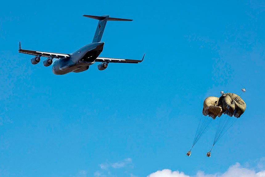 A RAAF C-17A Globemaster III aircraft drops cargo during Exercise Global Dexterity at Londonderry, New South Wales.