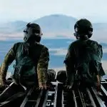 Royal Australian Air Force and United States Air Force loadmasters sit on the ramp of a No. 36 Squadron C-17A Globemaster III during a low level navigation sortie in North Queensland as part of Exercise Global Dexterity 23-1.