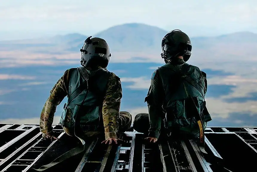 Royal Australian Air Force and United States Air Force loadmasters sit on the ramp of a No. 36 Squadron C-17A Globemaster III during a low level navigation sortie in North Queensland as part of Exercise Global Dexterity 23-1.