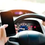 DON’T DO IT: Checking the phone when a message comes through is a habit young drivers must drop. Even a $1000 plus fine isn’t stopping them.