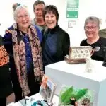 Guests at the ‘Swich to Green’ Art Exhibition looking over the entries.