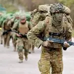 EXPERT TRAINING: Australian soldiers demonstrate patrol techniques to recruits from the Armed Forces of Ukraine in the UK.