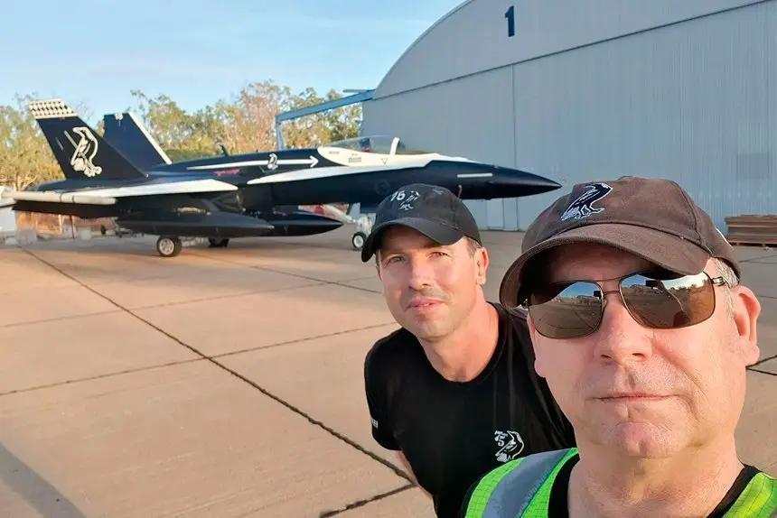 LAST PLANE: Surface finishers Steven Marshall and LAC Macdara Barden in front of their last plane a FA 18A Hornet.