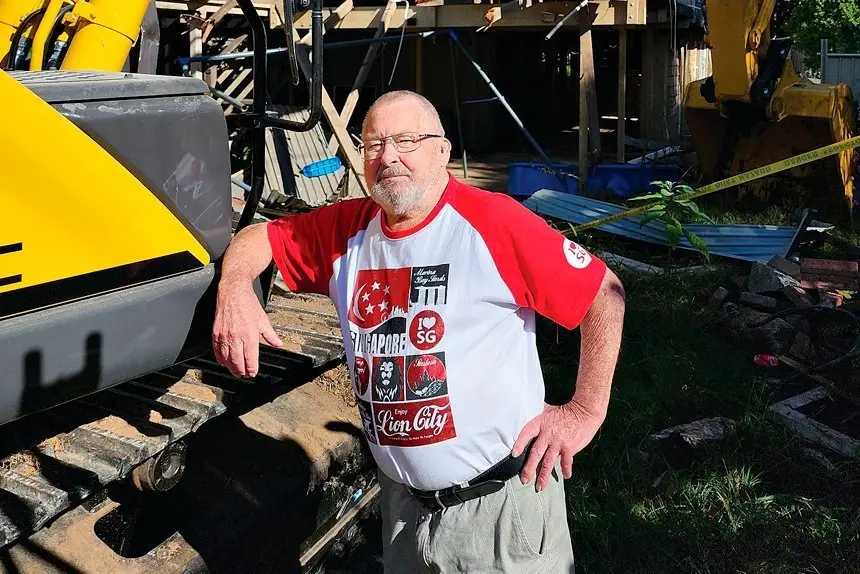 LET HER RIP: Frank Beaumont takes one last look at his home of 35 years before it was totally torn down.