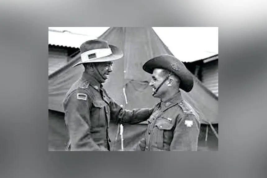 Lieutenant T.C. Derrick, (right) with Lt R. W. Saunders (left). Lt Saunders was the first Aboriginal commissioned in the Australian Army.
