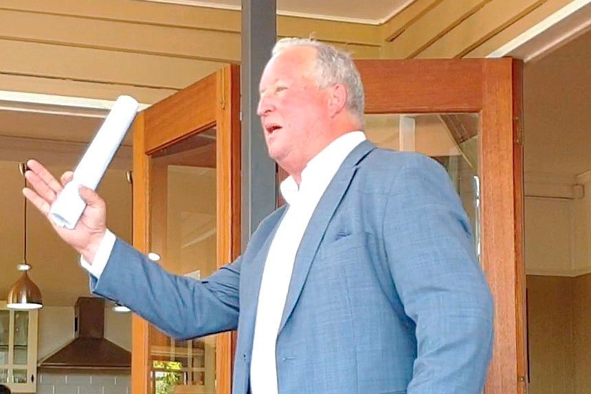 ALL SILENT: Leading Southeast Queensland auctioneer, Richard Keeley, finishes another auction with a sale.