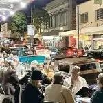 LAP NIGHT: The main street and the venues were packed for the Lap Night parade of classic cars.