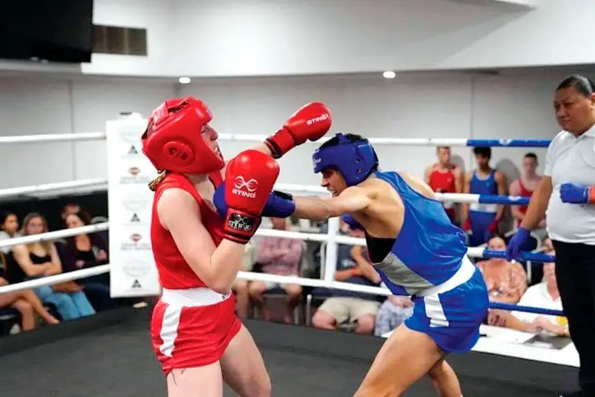 Local fighter Lateasha Barker in blue