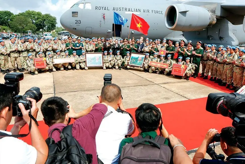 SUPPORT: Vietnam’s President Võ Văn Thưởng with peacekeepers from the Vietnam People’s Army Level Two Field Hospital contingent - Rotation Five, stand alongside a RAAF Globemaster during a farewell ceremony held in honour of their departure from Ho Chi Minh City, Vietnam.