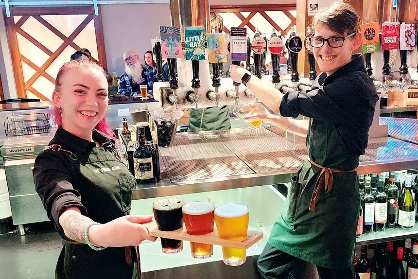 HERE’S CHEERS: Akasha Walbank and Ryan O’Halloran have 72 beers to offer you at the PA.