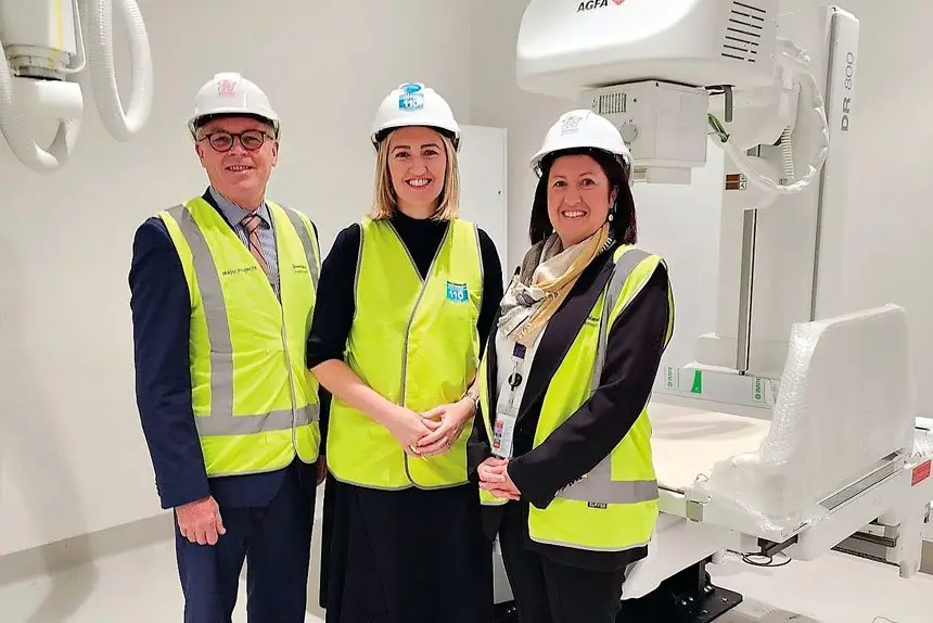 ON TRACK: West Moreton Health Chair, Michael Willis, Minister for Health, Shannon Fentiman and West Moreton Health CEO, Hannah Bloch, during a recent inspection of the Ripley Satellite Hospital. x-ray room.