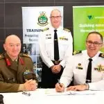 READY TO TRAIN: Brigadier Glenn Ryan and Commodore John Stavridis sign the Joint Technical Trades and Training Services contract with Captain Scott Houlhan as witness at the Australian Defence Force Academy in Canberra.