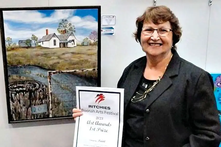 Artist Denise Taylor with her winning artwork.