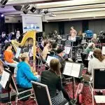 CROWDED: The current Ipswich Civic Centre set-up requires orchestras for major productions to set up downstairs and watch the stage performance on a pull down screen.