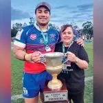HERE’S THE CUP: Redbank Club president, Jodie Elder holds the trophy with Somi, a first time premiership winning coach,