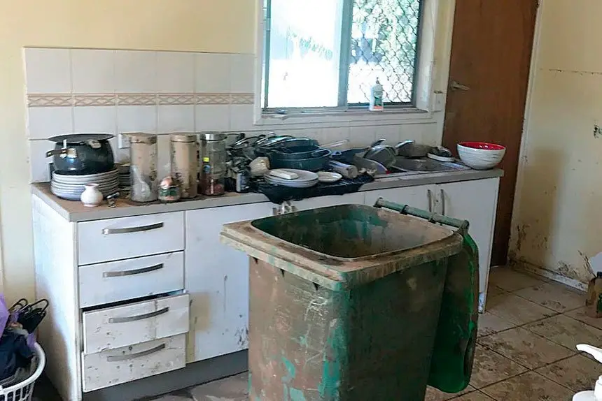 MUD MESS: Inches of mud had to be hosed out of the home.