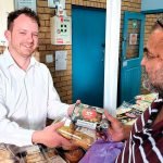TIME TO HELP: Brayden Currey takes time out from his business every Friday morning to help hand out food parcels at the Camira Springfield Community Centre.
