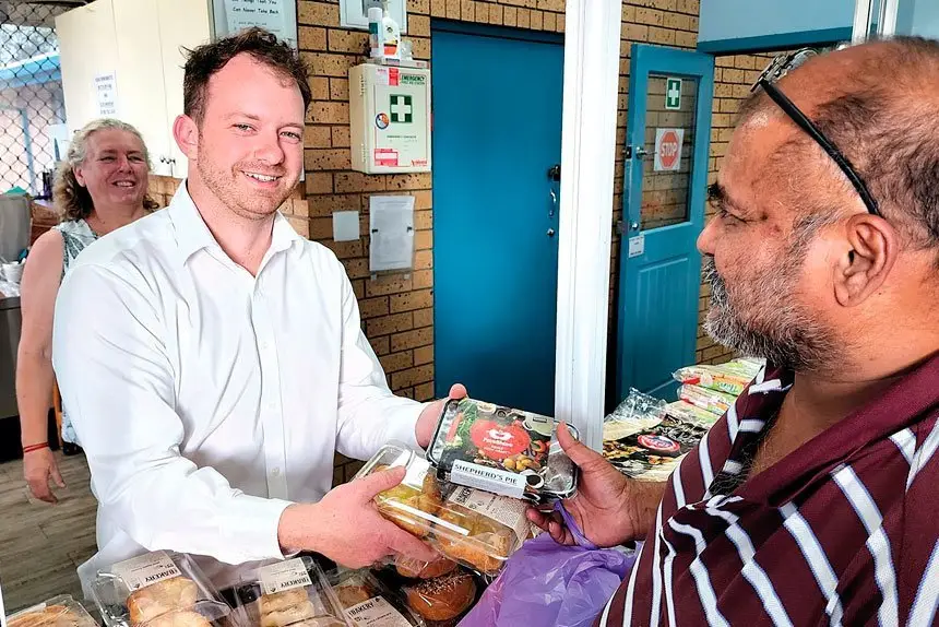 TIME TO HELP: Brayden Currey takes time out from his business every Friday morning to help hand out food parcels at the Camira Springfield Community Centre.