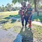 TIME TO SELL: Former Goodna flood home owner, Chris Onyeajum, is advising owners to grab the buy-back offer before it goes. He is pictured with his son, Nnamdi.
