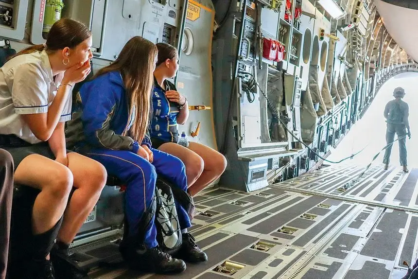 WORLD BELOW: Bremer State High School, Ipswich, Indigenous students Harmony Shaddick, Arielle Wilson and Koda Sheather flying in a No. 26 Squadron C-17 Globemaster III on a NAIDOC familiarisation flight from RAAF Base Amberley.