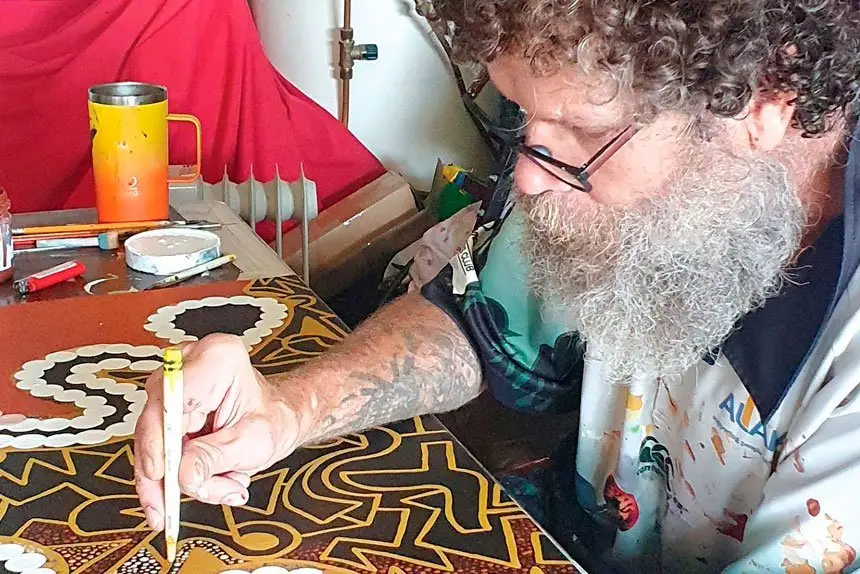 Artist Tallman creating work for his upcoming exhibition.