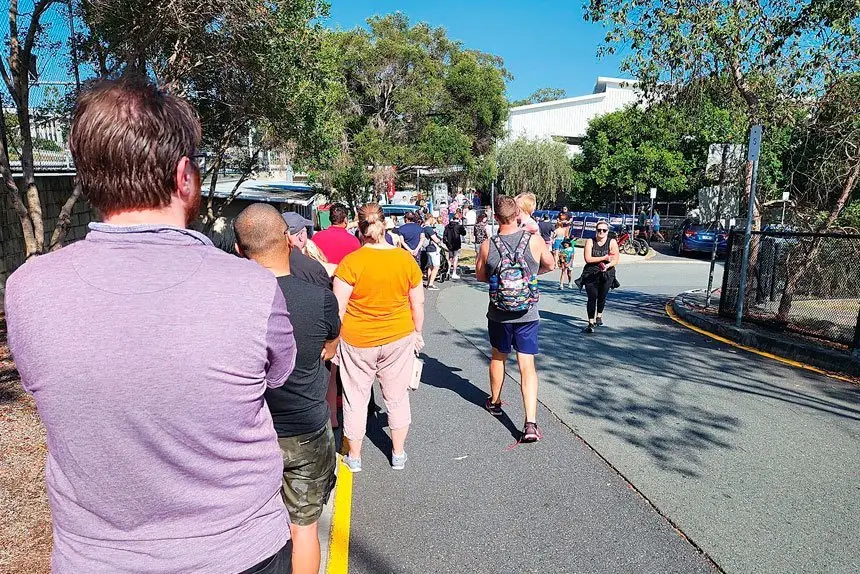BATTLE TO VOTE: The long queue at Springfield went back 250 metres.