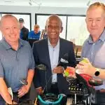 NEW GOLF SHOP: Maha Sinnathamby (centre) with Brookwater Professional, Dwayne Kirwin and GM Patrick Young.