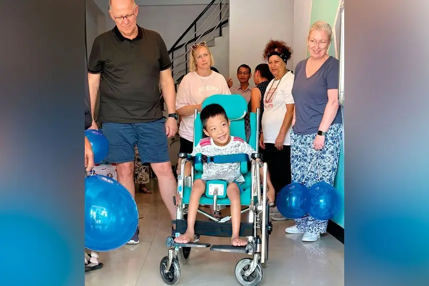 THANKS: A youngster gets the wheelchair he has needed for years.