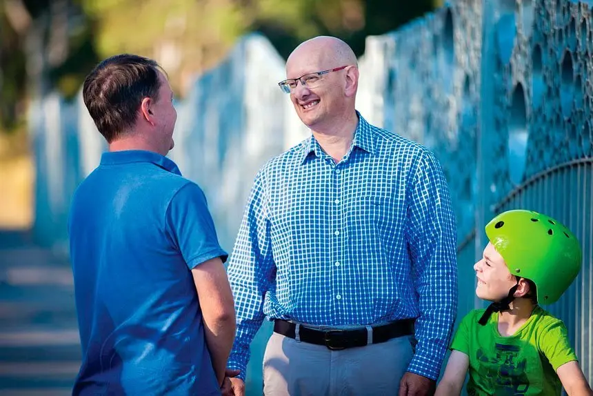 WE CAN HELP: Shayne Neumann talks to a local family about the home grants opportunities.