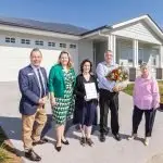 WELCOME: Mayor Teresa Harding and Councillors Russell Milligan and Kate Kunzelmann welcome the Riddell family to Ipswich.
