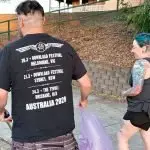 Chloe and Nick collect trash on their evening walk.