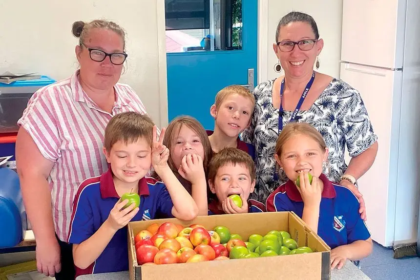 CRUNCH CREW: Parent volunteer Jen Errock, teacher aide Ann McGreevy and munchkins Ivan, Micah, Sylar, Matilda and Lilith.