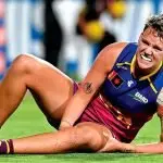 Dakota Davidson grasps her injured knee, bringing alarm to fans in the crowd.