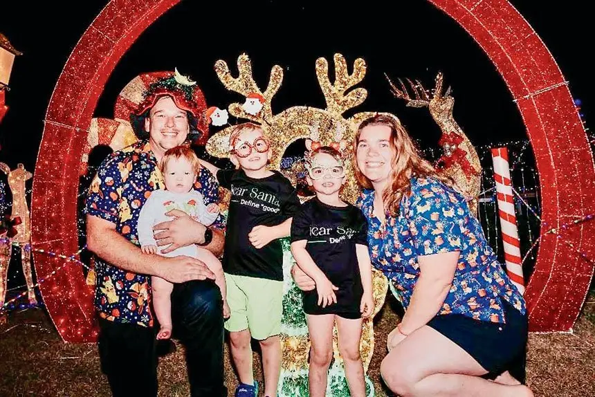Katelyn, Andy and their kids get ready for Christmas with their festive lights.