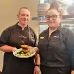 Head chef Chris Celere and functions and events co-ordinator Emily Jackson serve up delicious food.