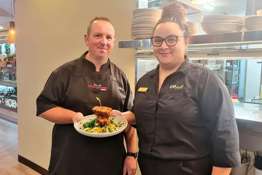 Head chef Chris Celere and functions and events co-ordinator Emily Jackson serve up delicious food.
