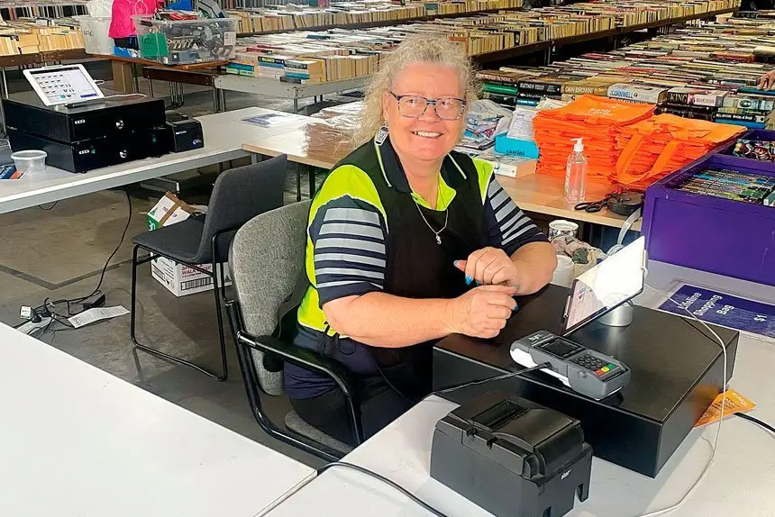 Doris Brown, hard at work taking buyers’ money