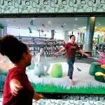 MAGICAL MOMENT: Deondre Huff, 8, and Mahailiyah Huff, 12, enjoy the butterfly experience.